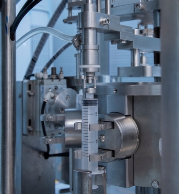 Machine de remplissage et d' enveloppe de seringue en plastique jetable automatique pour gel et crème