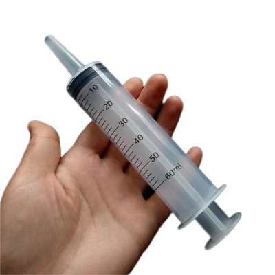 Machine de remplissage et d' enveloppe de seringue en plastique jetable automatique pour gel et crème