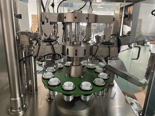 Machine automatique de remplissage et d'étanchéité de tubes souples en plastique ou en stratifié